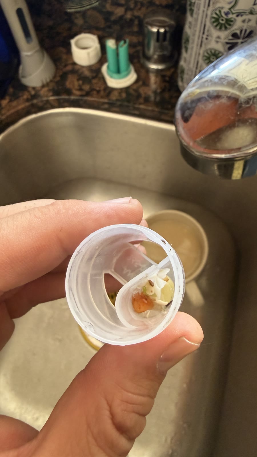 Food debris removed from a clogged dishwasher air gap in Fremont
