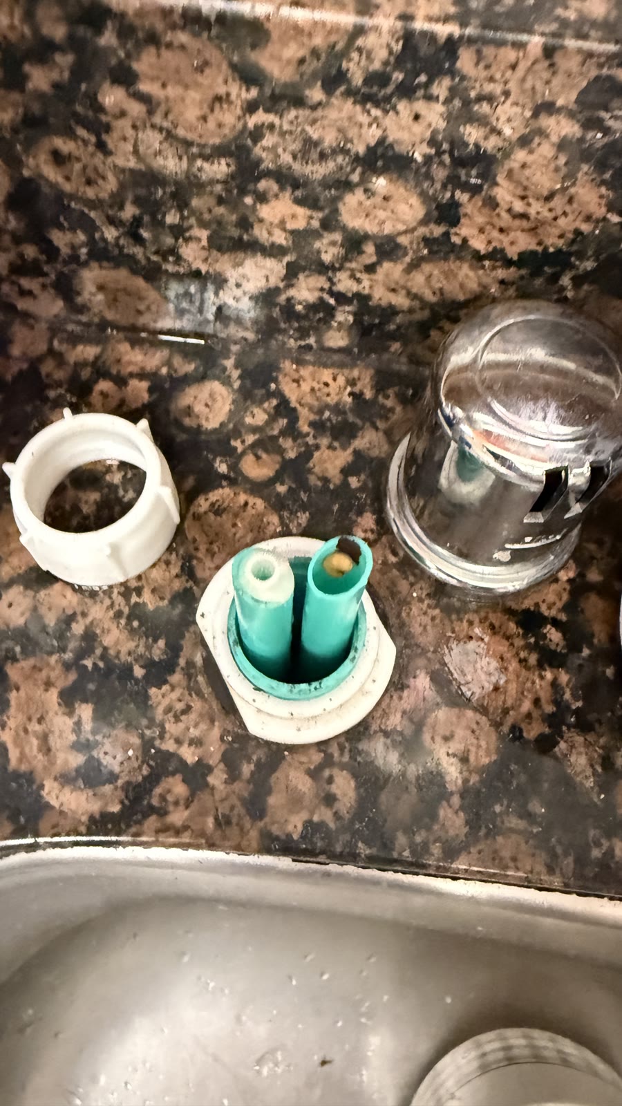Sink-mounted dishwasher air gap disassembled for cleaning in Fremont
