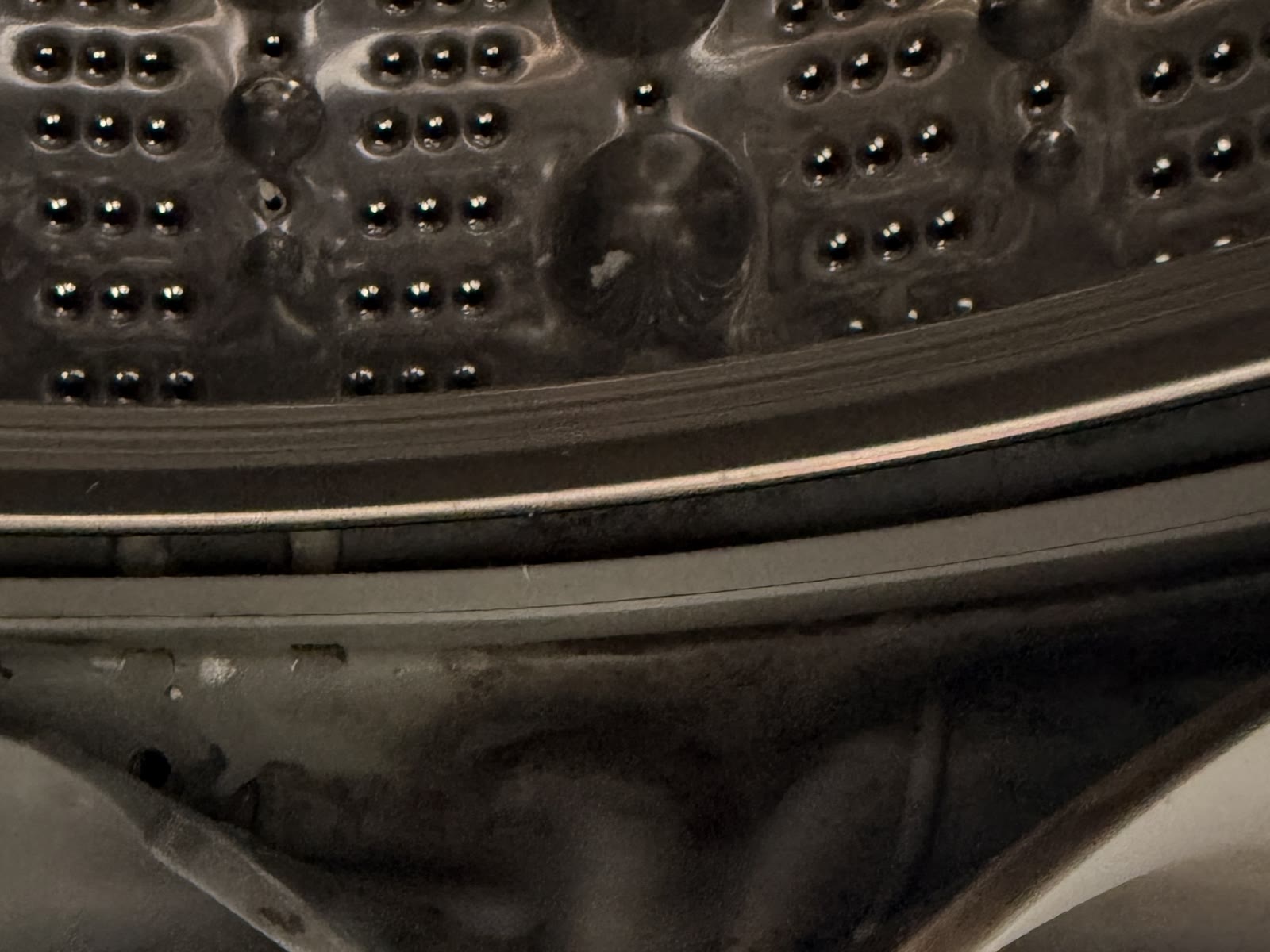 Close-up of hidden buildup inside the LG washer door gasket fold in San Ramon