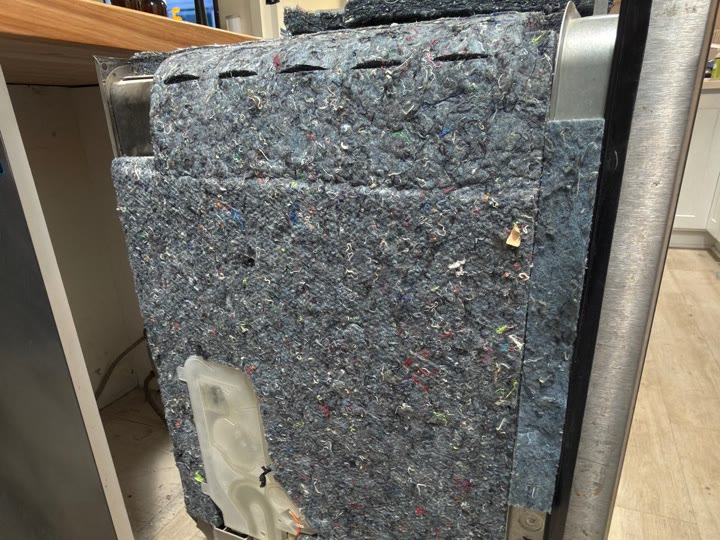 Side insulation removed from Bosch dishwasher SHPM78Z55N/22 during repair in Fremont California