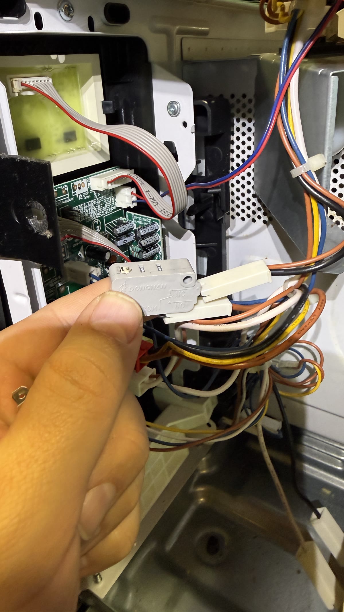 Failed Frigidaire Gallery microwave door switch replaced during Fremont repair