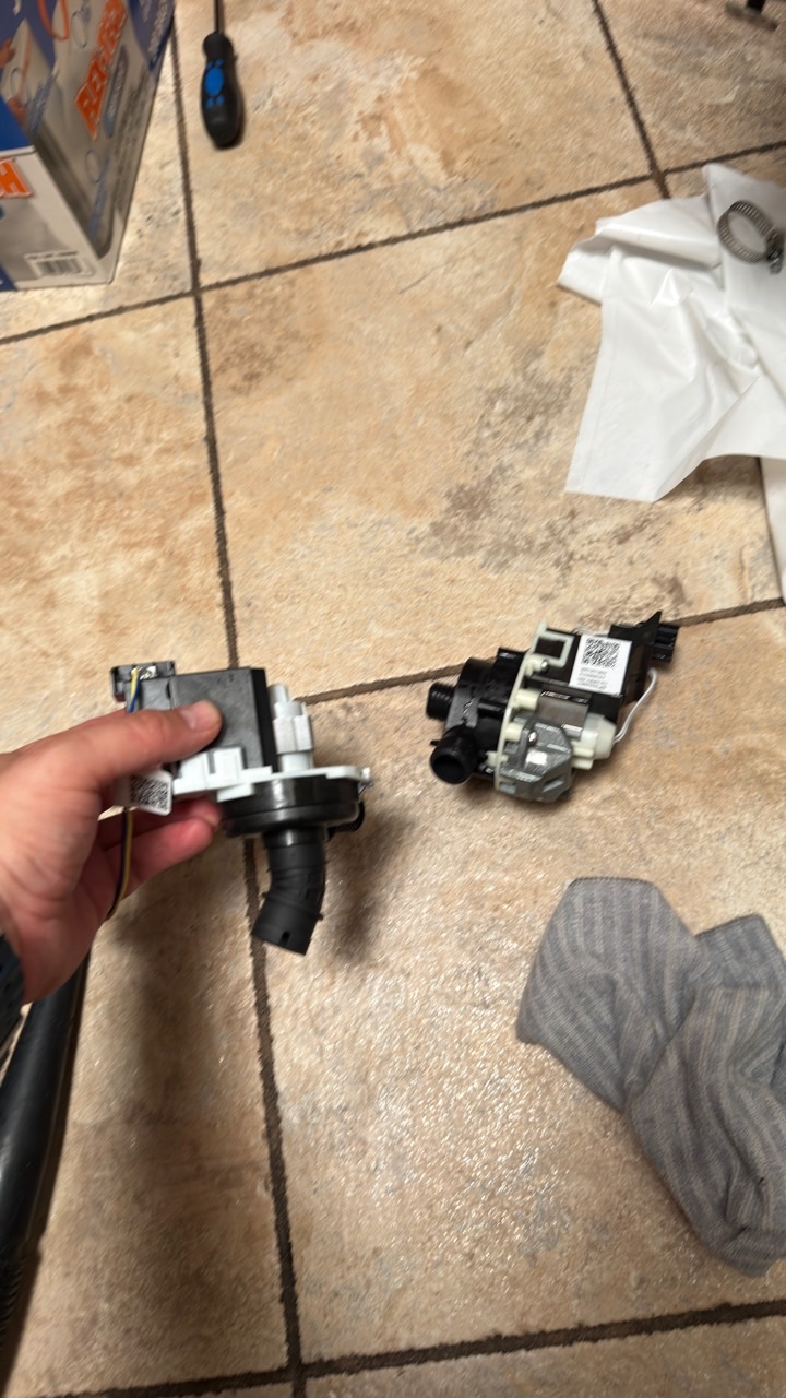 Old and replacement GE dishwasher drain pumps compared during Fremont repair