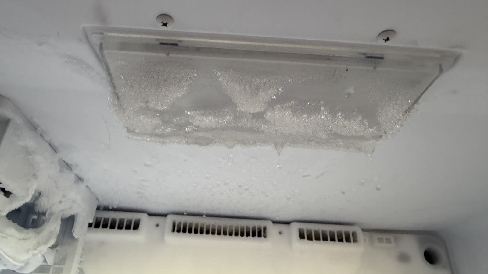 Ice and frost build-up inside Kenmore refrigerator before defrost service in Fremont