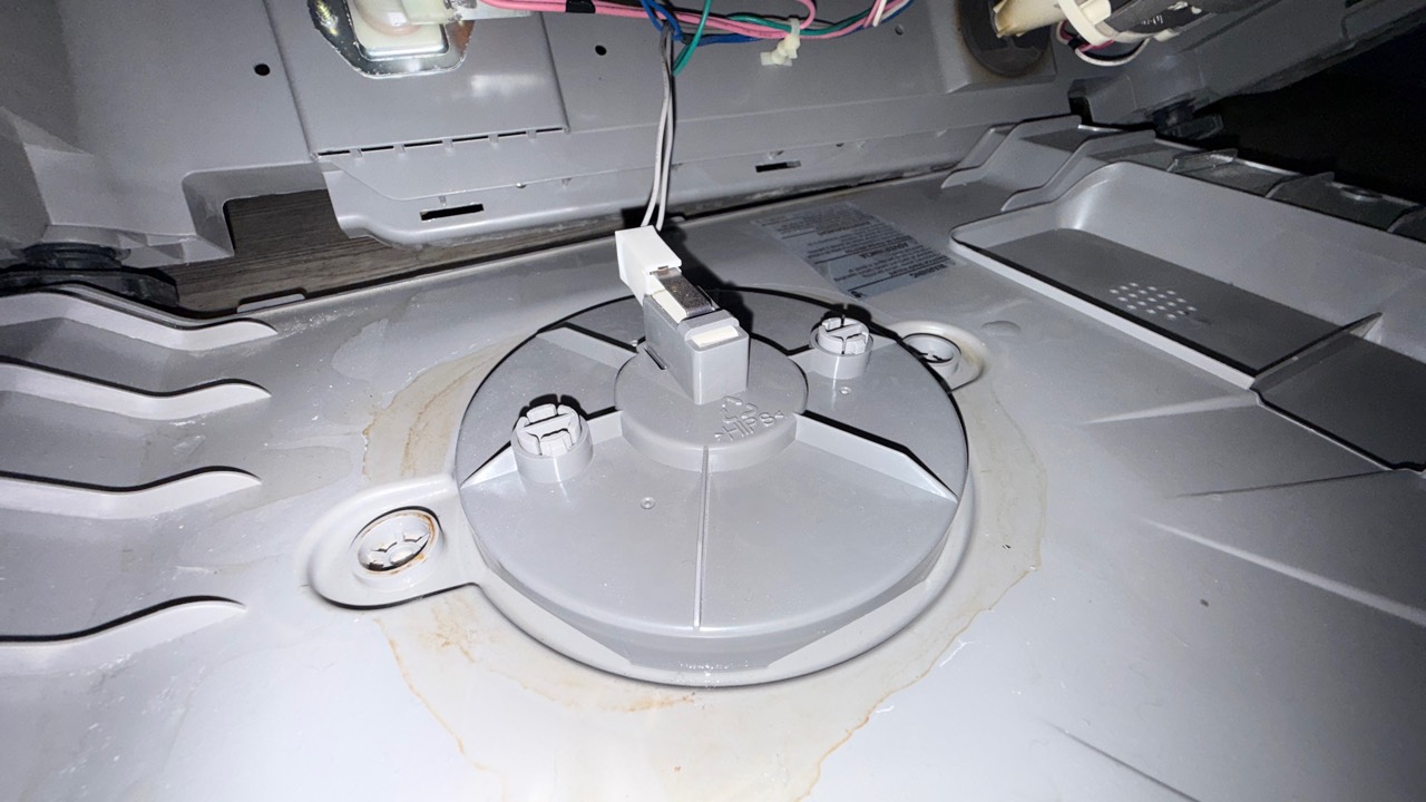 Water residue around the leaking drain pump area of a Samsung dishwasher in Pleasanton CA