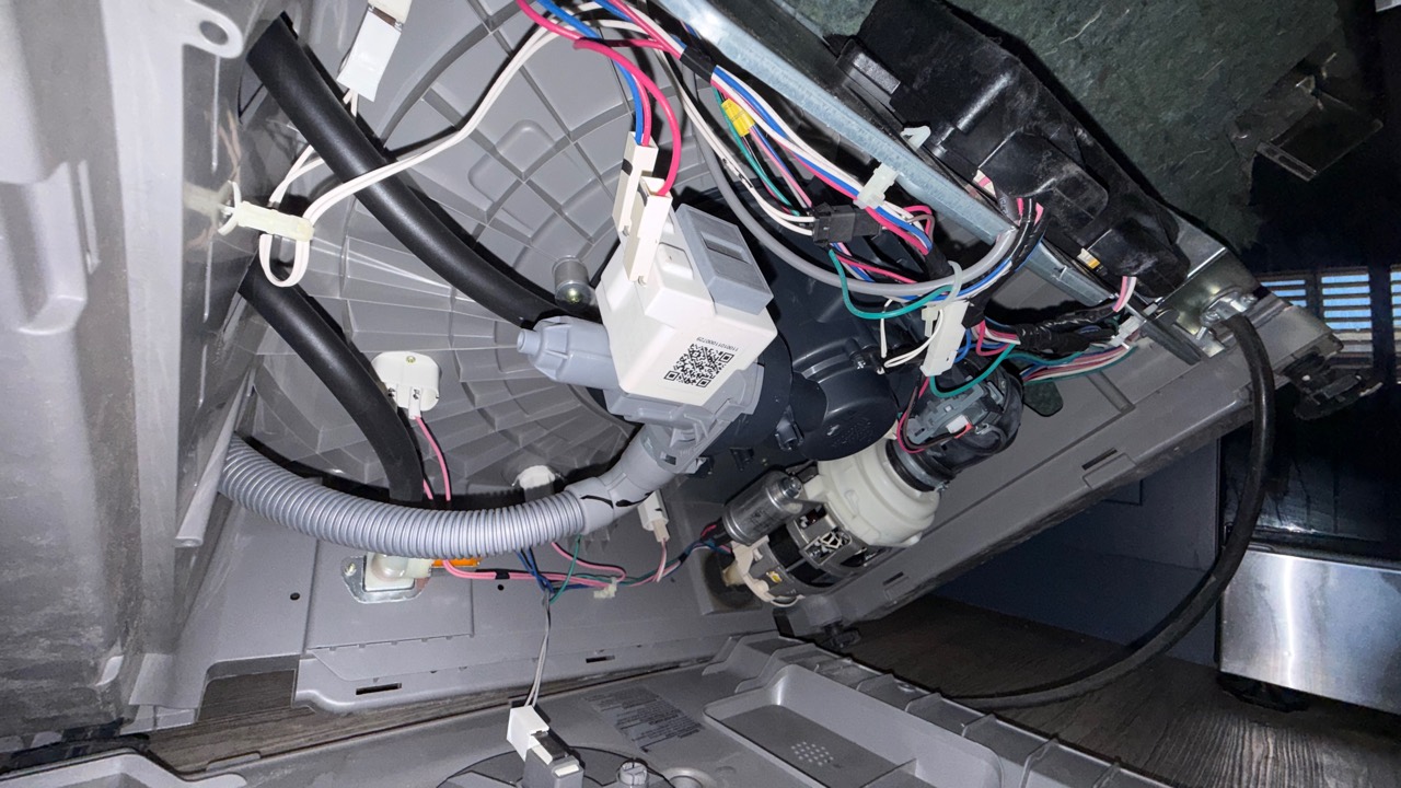 Underside of Samsung DW80R2031US dishwasher showing drain pump access in Pleasanton CA