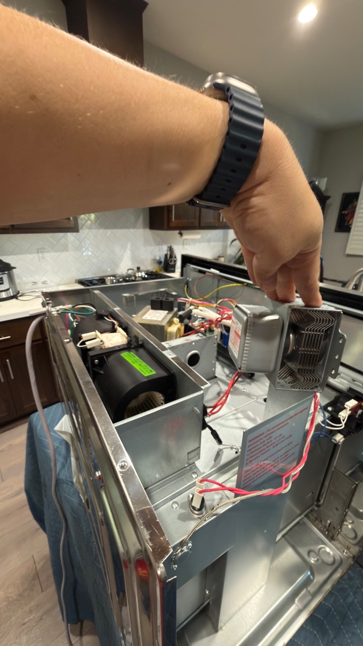 Technician replacing the magnetron in a Thermador built-in microwave in Alamo CA