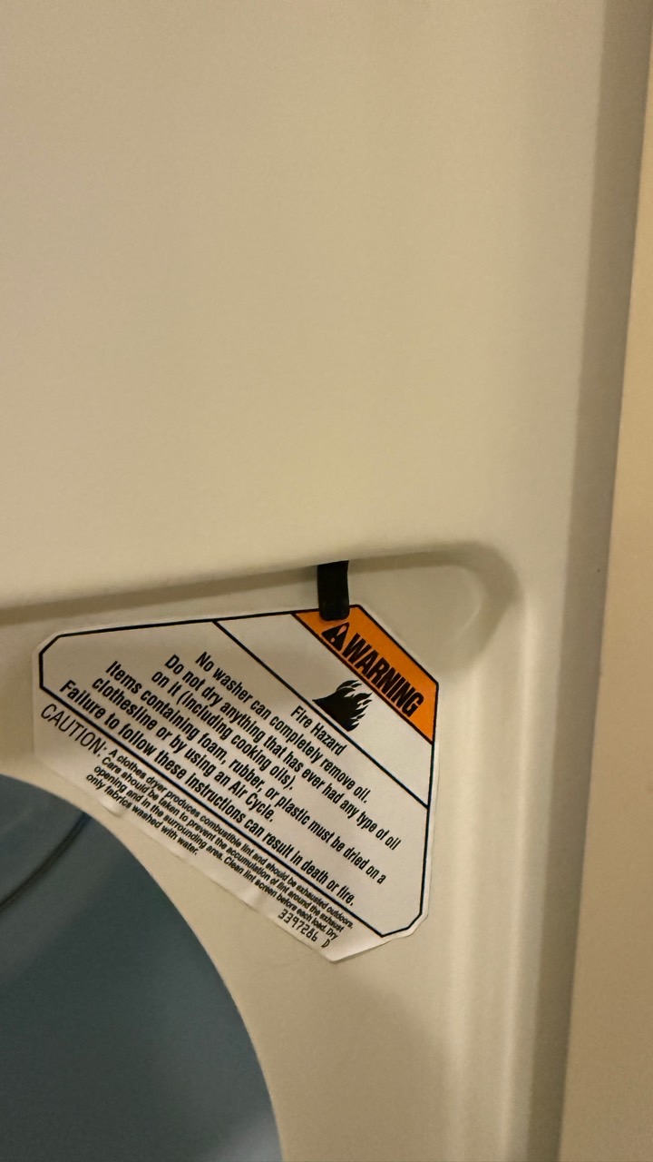 Whirlpool dryer door switch area checked during Pleasanton dryer safety repair