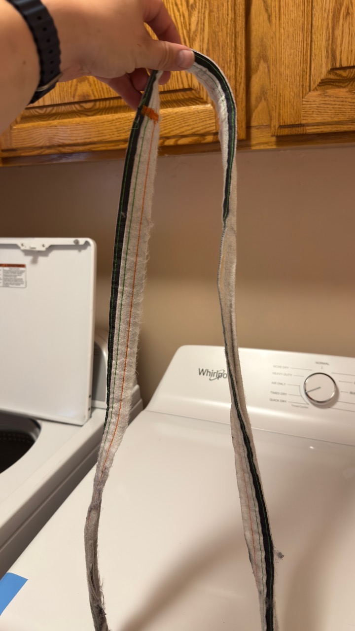 Loose Whirlpool dryer felt seal showing adhesive failure during Palo Alto diagnosis